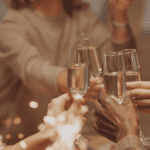 a group of people clinking glasses